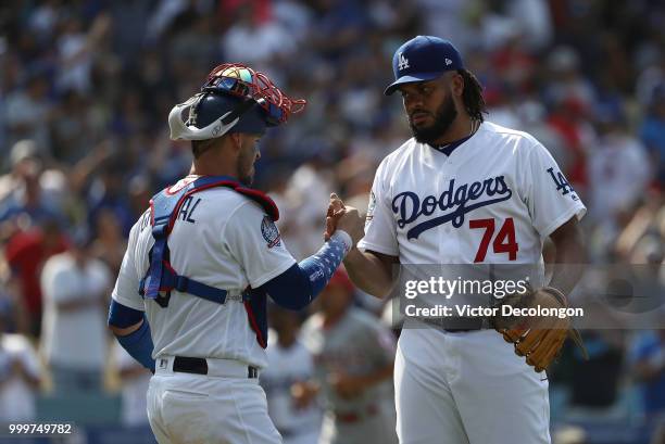 Catcher Yasmani Grandal and pitcher Kenley Jansen of the Los Angeles Dodgers shake hands after the last out of the MLB game against the Los Angeles...