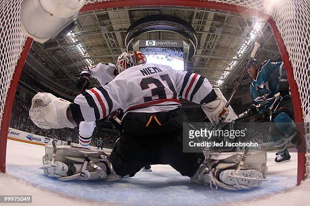 Goaltender Antti Niemi of the Chicago Blackhawks makes a save on Joe Pavelski of the San Jose Sharks in the first period in Game Two of the Western...