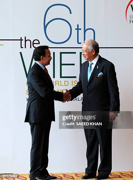 Malaysia Prime Minister Najib razak receives Brunei's Sultan Hassanal Bolkiah for an opening ceremony of the 6th World Islamic Economic Forum in...