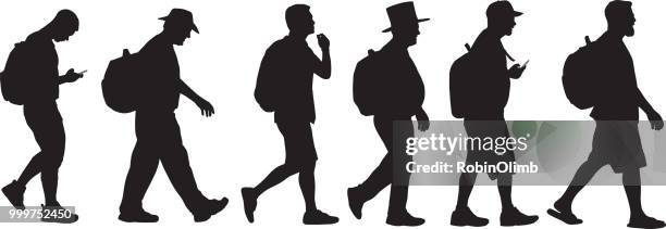 men walking with backpacks silhouettes - robinolimb stock illustrations