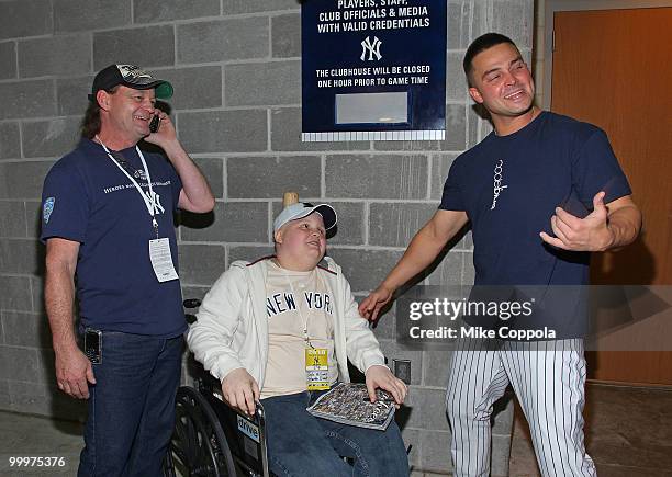 Roger Williams, Jack Williams, and New York Yankees outfielder Nick Swisher attend the starter event at NY Yankees batting practice at Yankee Stadium...