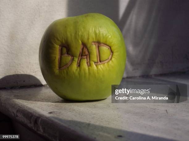 bad apple - carolina miranda stock pictures, royalty-free photos & images