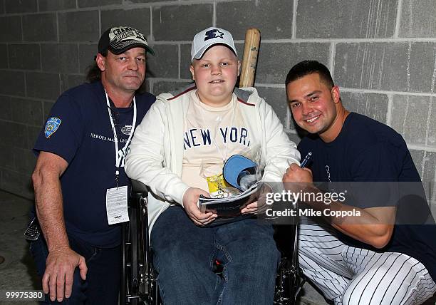 Roger Williams, Jack Williams, and New York Yankees outfielder Nick Swisher attend the starter event at NY Yankees batting practice at Yankee Stadium...