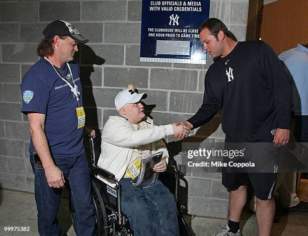 Roger Williams, Jack Williams, and New York Yankees pitcher Joba Chamberlain attend the starter event at NY Yankees batting practice at Yankee...