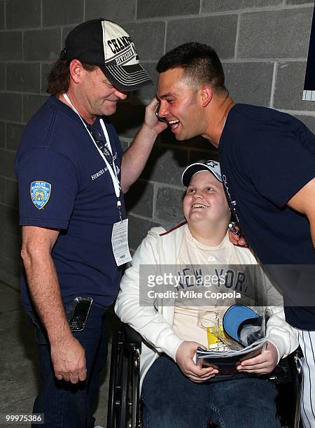 Roger Williams, Jack Williams, and New York Yankees outfielder Nick Swisher attend the starter event at NY Yankees batting practice at Yankee Stadium...