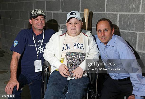 Roger Williams, Jack Williams, and New York Yankees General Manager Brian Cashman attend the starter event at NY Yankees batting practice at Yankee...