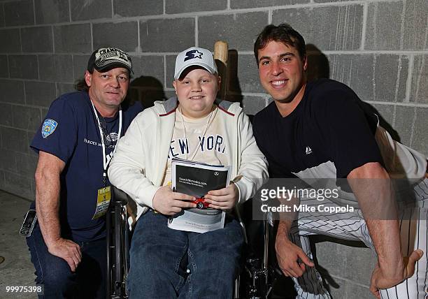 Roger Williams, Jack Williams, and New York Yankees first baseman Mark Teixeira attend the starter event at NY Yankees batting practice at Yankee...