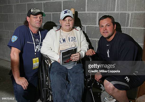 Roger Williams, Jack Williams, and New York Yankees pitcher Joba Chamberlain attend the starter event at NY Yankees batting practice at Yankee...