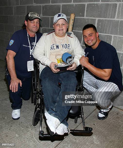 Roger Williams, Jack Williams, and New York Yankees outfielder Nick Swisher attend the starter event at NY Yankees batting practice at Yankee Stadium...