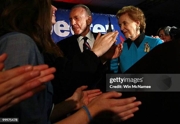 Sen. Arlen Specter leaves the stage after conceding defeat at a primary night gathering of supporters and staff with his wife Joan Specter and family...