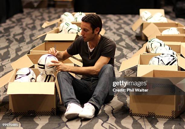 Ivan Vicelich of the New Zealand All Whites signs footballs during a signing session at the Sky City Convention Centre on May 19, 2010 in Auckland,...