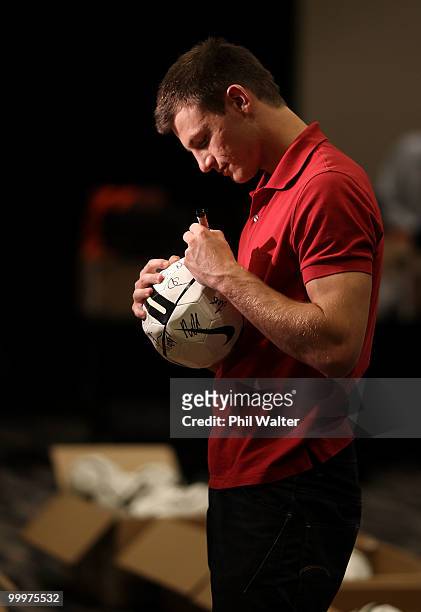 Tommy Smith of the New Zealand All Whites signs footballs during a signing session at the Sky City Hotel on May 19, 2010 in Auckland, New Zealand.