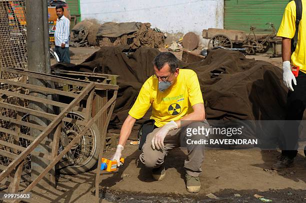 Greenpeace scientist Jan Vande Putte takes radiation measurements at the Mayapuri scrap market in New Delhi on May 19, 2010. India's atomic energy...