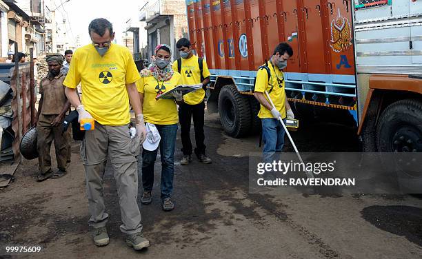 Greenpeace scientists Jan Vande Putte and Stan Vincent take radiation measurements at the Mayapuri scrap market in New Delhi on May 19, 2010. India's...