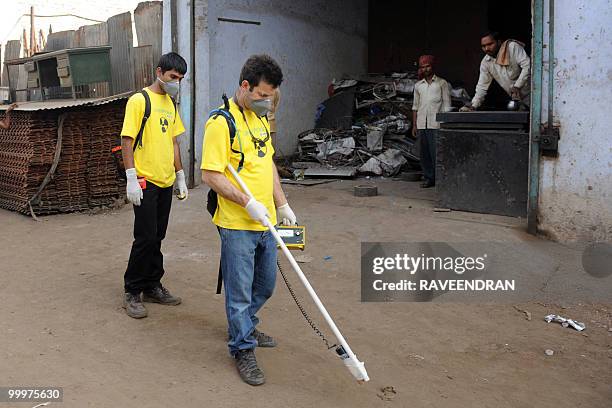 Greenpeace scientist Stan Vincent takes radiation measurements at the Mayapuri scrap market in New Delhi on May 19, 2010. India's atomic energy...