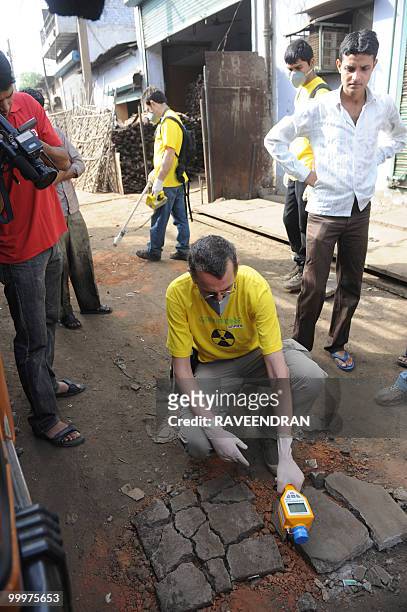 Greenpeace scientist Jan Vande Putte takes radiation measurements at the Mayapuri scrap market in New Delhi on May 19, 2010. India's atomic energy...