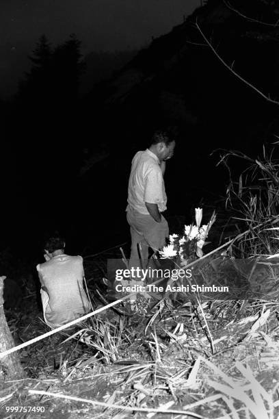 Bereaved family members climbs the Mt. Osutaka to commemorate the victims of the JAL 123 crash on August 12, 1986 in Ueno, Gunma, Japan.