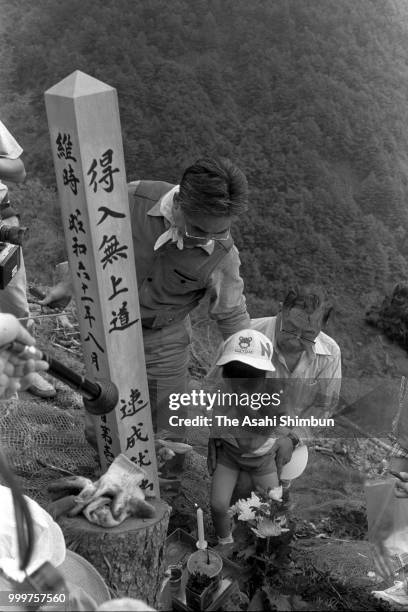 Bereaved family members climbs the Mt. Osutaka to commemorate the victims of the JAL 123 crash on August 12, 1986 in Ueno, Gunma, Japan.