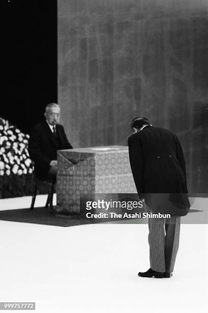 Prime Minister Yasuhiro Nakasone bows toward Emperor Hirohito during the memorial ceremony for war dead on the 41st anniversary of the WWII Surrender...