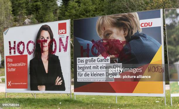 The election campaign posters of Rita Schwarzeluher-Sutter and Angela Merkel have the word 'Hooton' written on them in red paint in Schluchsee,...