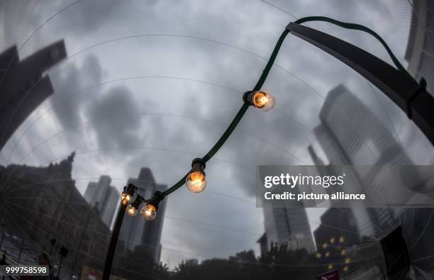 Dpatop - A chain of lights can be seen in an inflatable and accessable bubble made of transparent plastic below the towers befoer the official...