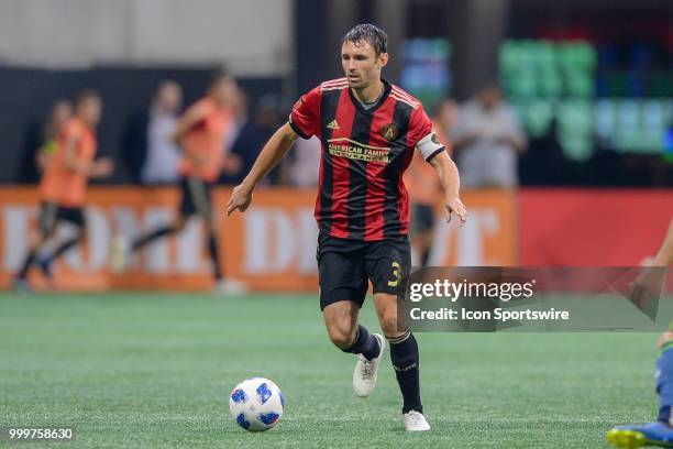 Atlanta's Michael Parkhurst brings the ball up the field during the match between Atlanta and Seattle on July 15th, 2018 at Mercedes-Benz Stadium in...