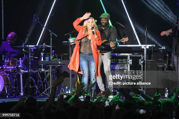 Singer Anastacia performs during the presentation of her fashion collection titled 'Music loves Fashion' for Aldi Sued in Cologne, Germany, 7...