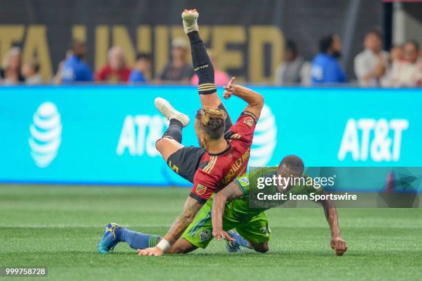 Seattles' Jordan McCrary earns a red card for taking down Atlanta's Leandro González Pirez during the match between Atlanta and Seattle on July 15th,...