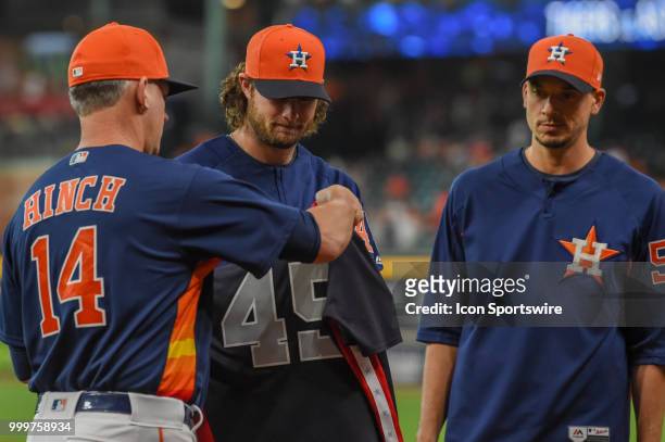 Houston Astros pitcher Gerrit Cole and Houston Astros pitcher Charlie Morton are presented their American League All Star uniforms by Houston Astros...