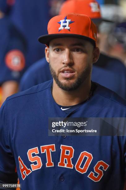 Houston Astros outfielder George Springer walks through the dugout before the baseball game between the Detroit Tigers and the Houston Astros on July...