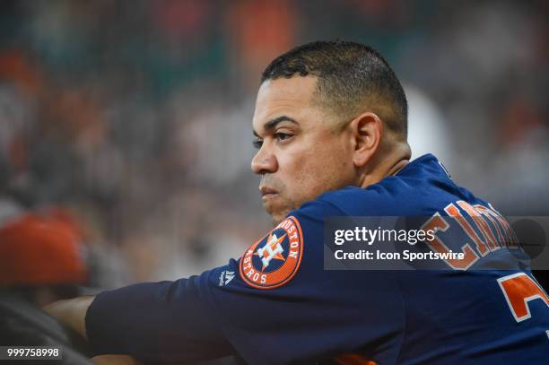 Houston Astros first base coach Alex Cintron looks on from the dugout during the baseball game between the Detroit Tigers and the Houston Astros on...