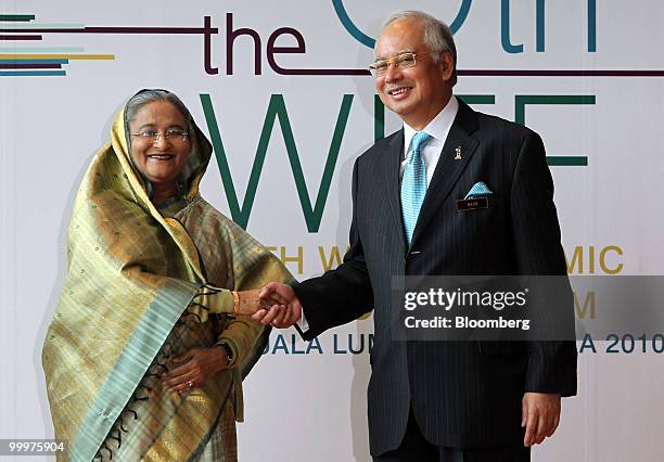 Sheikh Hasina Wajed, Bangladesh's prime minister, left, shakes hands with Najib Razak, Malaysia's prime minister, at the 6th World Islamic Economic...