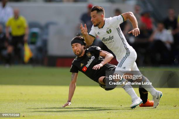 Lee Nguyen of the Los Angeles Football Club and Sebastian Blanco of the Portland Timbers battle for control of the ball at Banc of California Stadium...