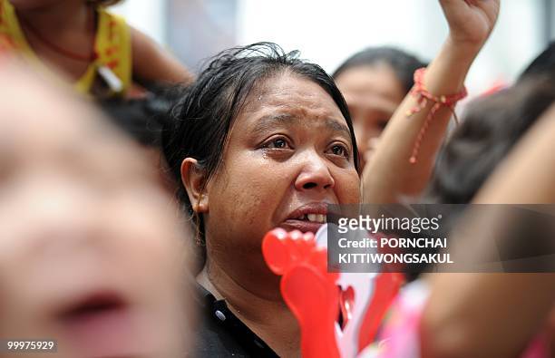 Female Red Shirt anti-government protester cries a few minutes before the leaders of the movement announced their surrender inside the protest camp...