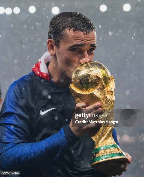 Antoine Griezmann of France celebrates with the World Cup Trophy following his sides victory in the 2018 FIFA World Cup Final between France and...