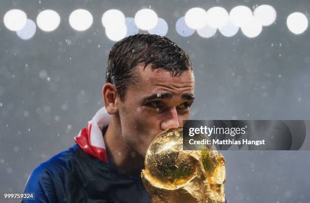 Antoine Griezmann of France celebrates with the World Cup Trophy following his sides victory in the 2018 FIFA World Cup Final between France and...