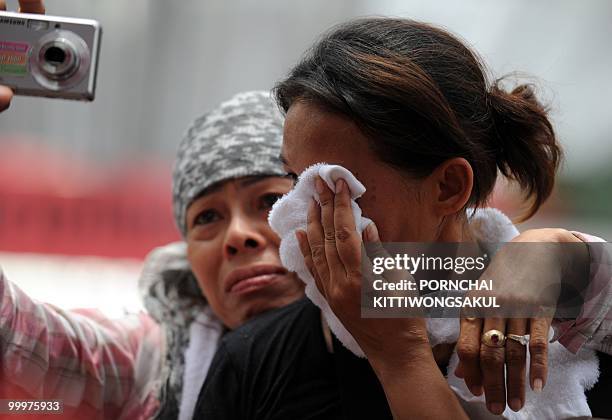 Female Red Shirt anti-government protester cries a few minutes before the leaders of the movement announced their surrender inside the protesters'...