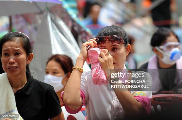 Female Red Shirt anti-government protester cries a few minutes before the leaders of the movement announced their surrender inside the protesters'...