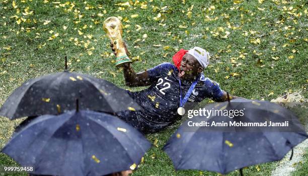 Benjamin Mendy holds up the trophy as he celebrates FIFA World Cup championship after the 2018 FIFA World Cup Russia Final between France and Croatia...