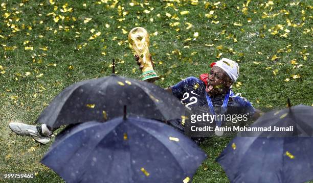Benjamin Mendy holds up the trophy as he celebrates FIFA World Cup championship after the 2018 FIFA World Cup Russia Final between France and Croatia...