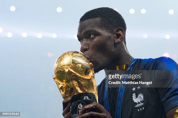 Paul Pogba of France celebrates with the World Cup Trophy following his sides victory in the 2018 FIFA World Cup Final between France and Croatia at...