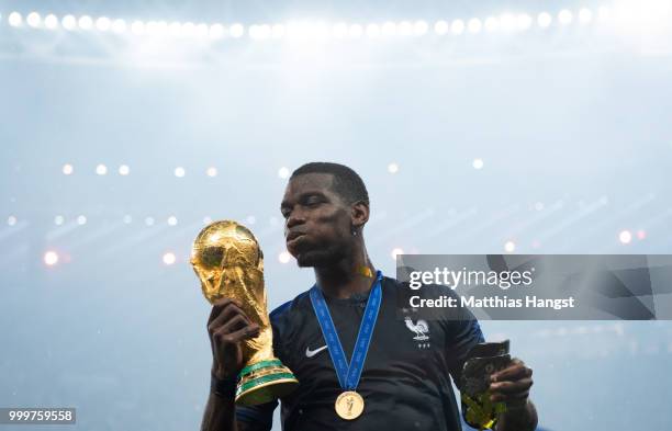 Paul Pogba of France celebrates with the World Cup Trophy following his sides victory in the 2018 FIFA World Cup Final between France and Croatia at...