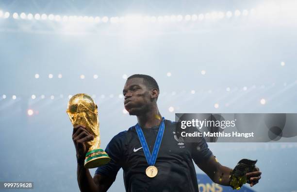 Paul Pogba of France celebrates with the World Cup Trophy following his sides victory in the 2018 FIFA World Cup Final between France and Croatia at...