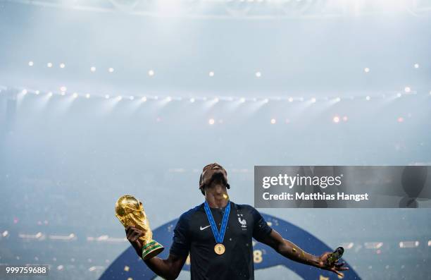 Paul Pogba of France celebrates with the World Cup Trophy following his sides victory in the 2018 FIFA World Cup Final between France and Croatia at...