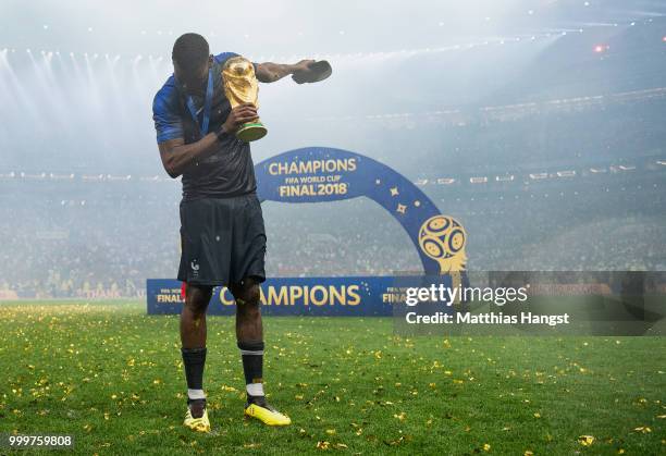 Paul Pogba of France celebrates with the World Cup Trophy following his sides victory in the 2018 FIFA World Cup Final between France and Croatia at...