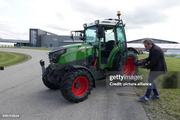 Camera man films the first electrically powered tractor of the German producer Fendt, on its workshop premises in Marktoberdorf, Germany, 8 September...