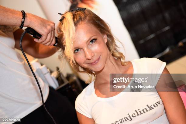 Model prepares backstage at Miami Swim Week powered by Art Hearts Fashion Swim/Resort 2018/19 at Faena Forum on July 15, 2018 in Miami Beach, Florida.