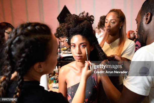 Model prepares backstage at Miami Swim Week powered by Art Hearts Fashion Swim/Resort 2018/19 at Faena Forum on July 15, 2018 in Miami Beach, Florida.