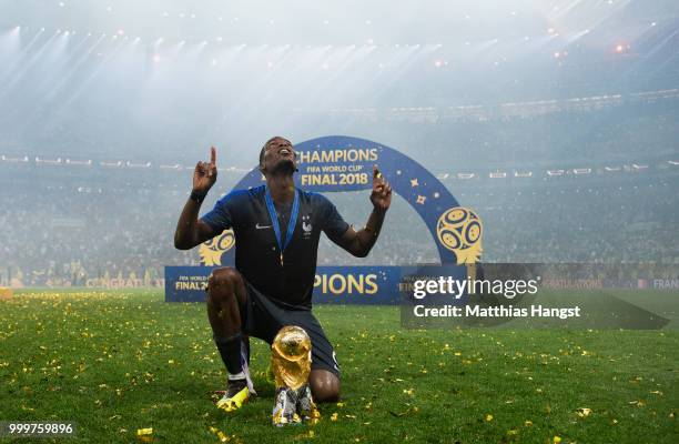 Paul Pogba of France celebrates with the World Cup Trophy following his sides victory in the 2018 FIFA World Cup Final between France and Croatia at...