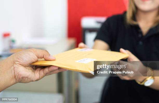 Handing Envelope 479 Hand Giving Envelope Stock Photos, High-Res Pictures, and Images ...